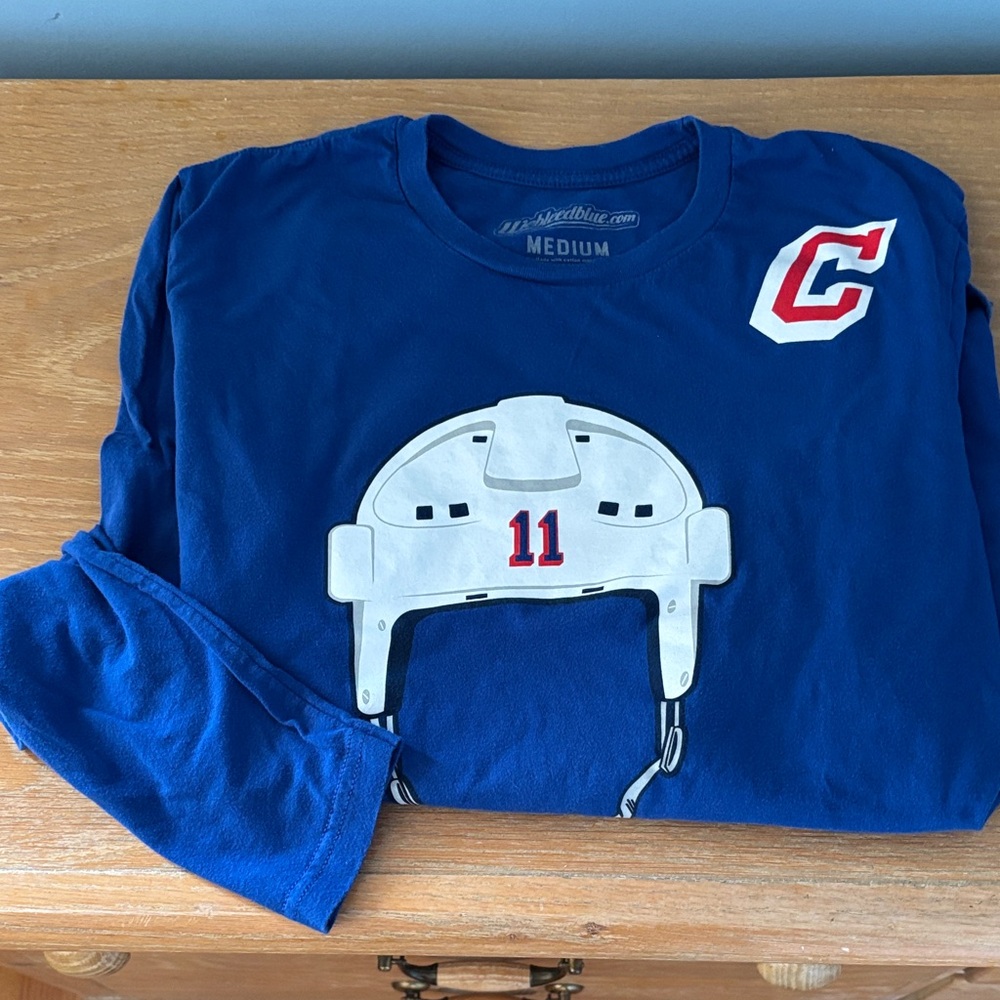 We Bleed Blue Long Sleeve Tee with Helmet Graphic